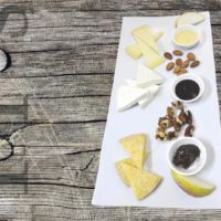 Assortment of cheeses with jams and fruit
